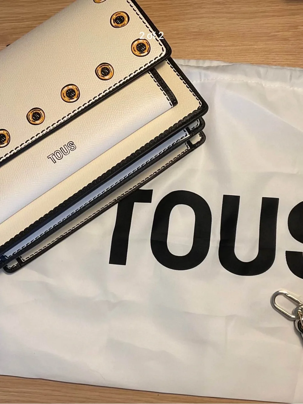 TOUS White Leather Clutch with Gold Grommet Accents